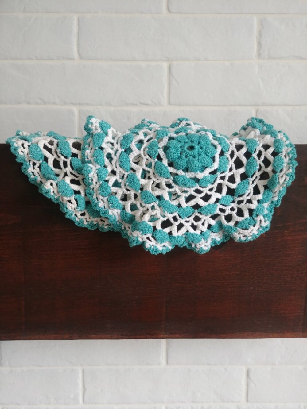 Set of two matching bright turquoise blue and white crochet doilies